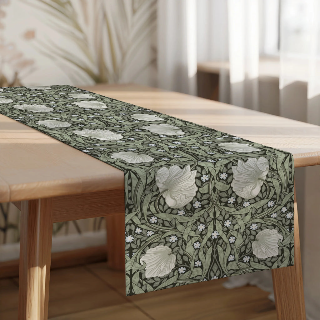 William Morris Pimpernel table runner in Dreamy Sage layered over a linen tablecloth