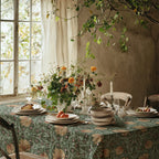 William Morris Pimpernel tablecloth in Sage and Amber on a dining table