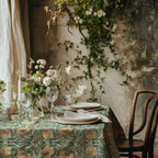 William Morris Pimpernel tablecloth in Sage and Amber with a place setting