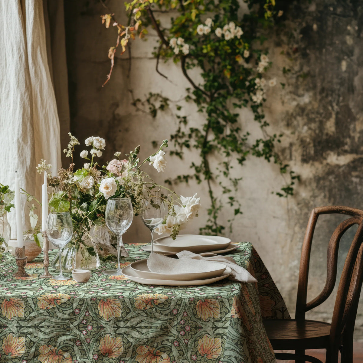 William Morris Pimpernel tablecloth in Sage and Amber with a place setting