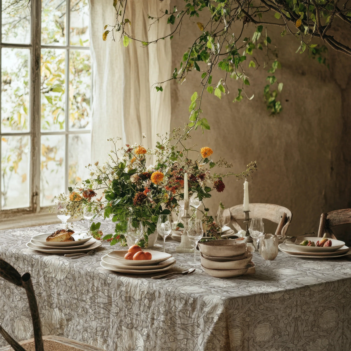 William Morris Pimpernel tablecloth in Soft Beige on a dining table