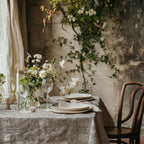 William Morris Pimpernel tablecloth in Soft Beige with a place setting