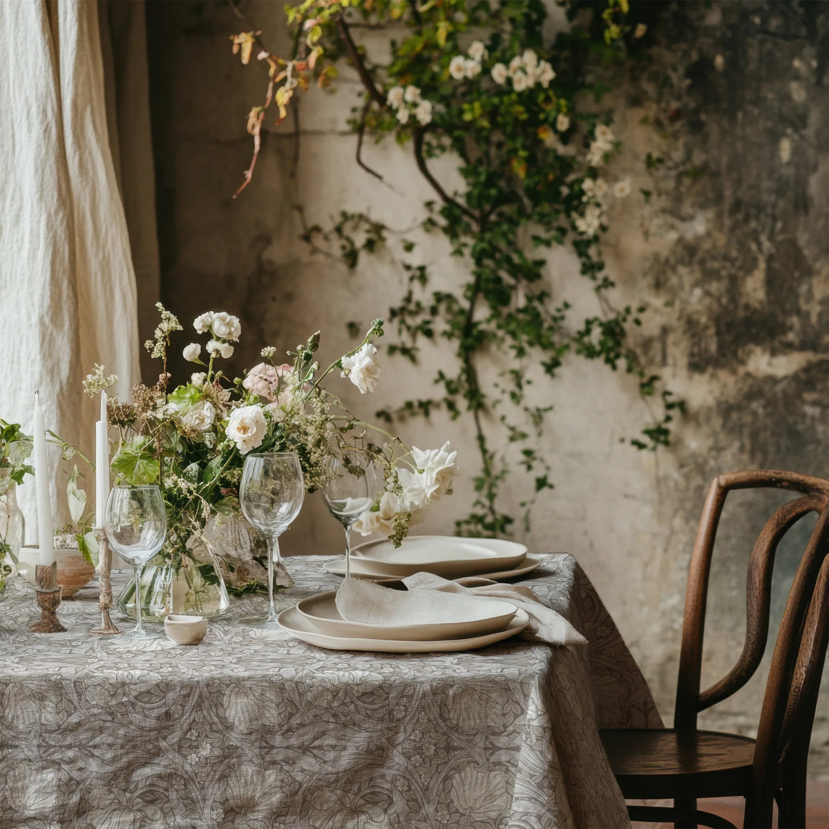 William Morris Pimpernel tablecloth in Soft Beige with a place setting