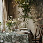 William Morris Pimpernel tablecloth in Deep Sage and Cream with a place setting