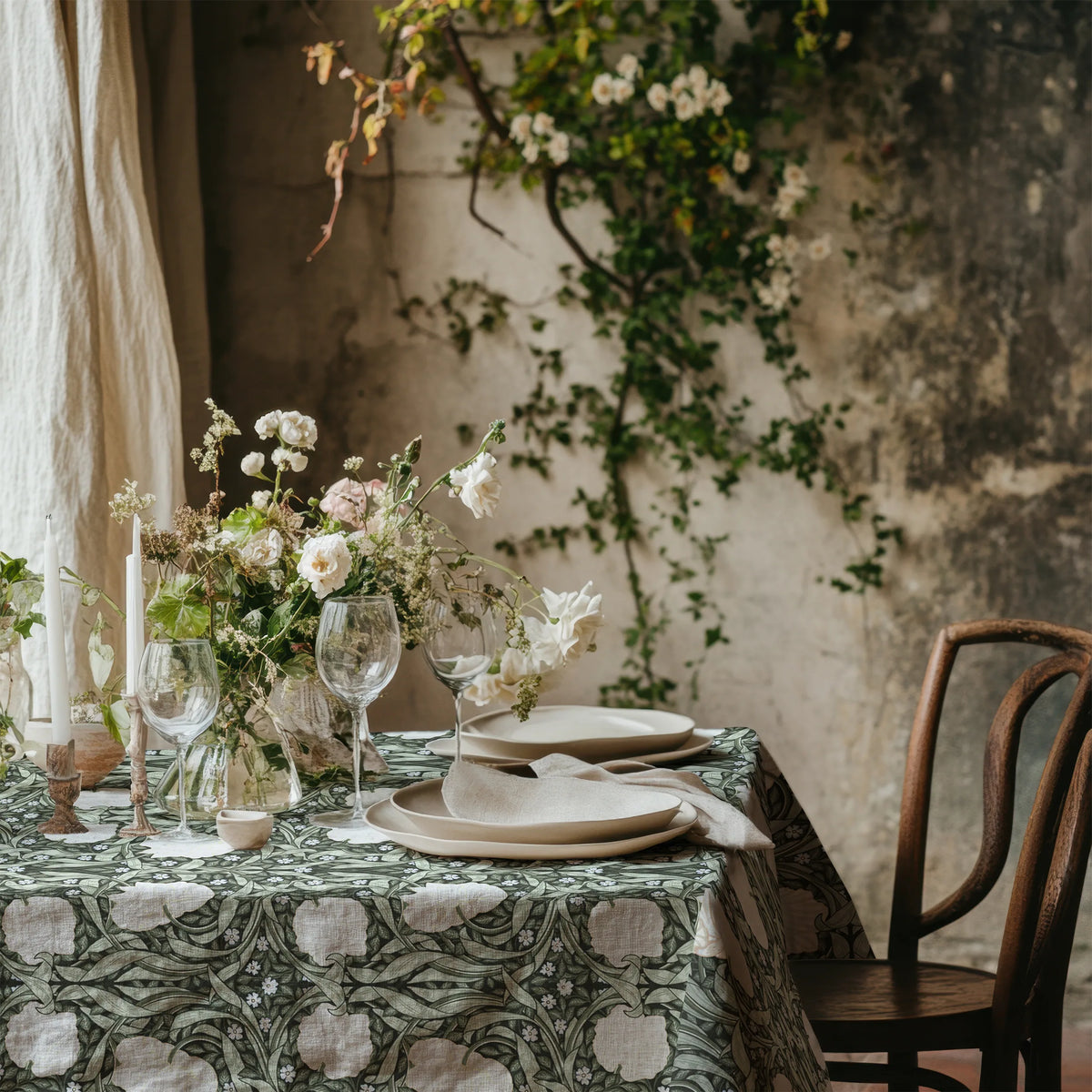 William Morris Pimpernel tablecloth in Deep Sage and Cream with a place setting