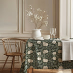 William Morris Pimpernel tablecloth in Deep Sage and Cream in a styled dining room