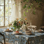 William Morris Pimpernel tablecloth in Blue and Gold on a dining table