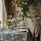 William Morris Pimpernel tablecloth in Blue and Gold with a place setting