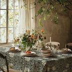 William Morris Pimpernel tablecloth in Sage and Cream on Ebony on a dining table