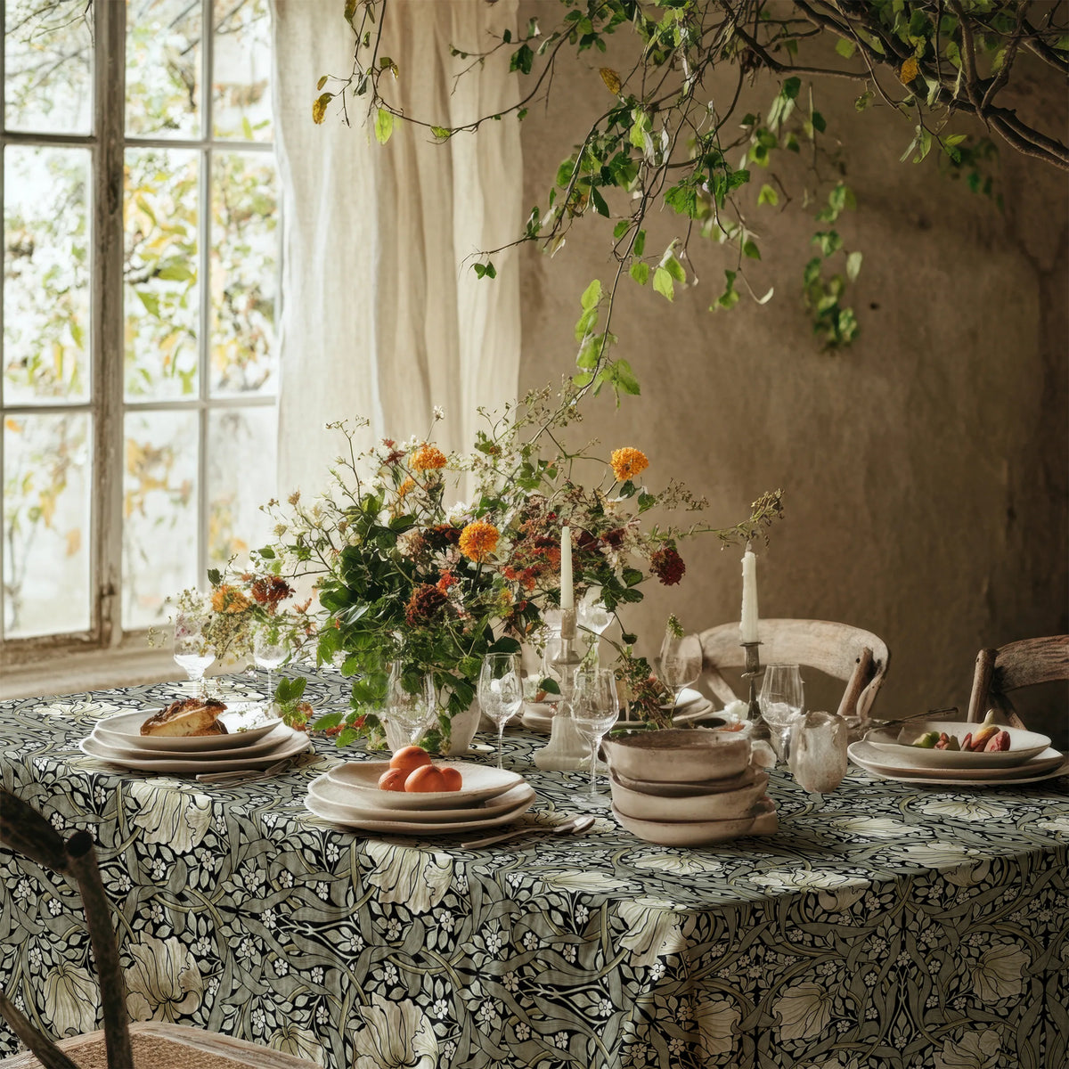 William Morris Pimpernel tablecloth in Sage and Cream on Ebony on a dining table