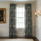 William Morris Pimpernel curtains in Blue and Sage at a window in a panelled room with brass sconces