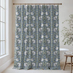 William Morris Pimpernel extra long shower curtain in Blue & Sage 2143: cream tulips and sage-green leaves on a deep navy ground. Floor-length cotton sateen hung from a high-mounted rod in a bright bathroom, handmade to order in 84, 96 and 108 inch lengths.