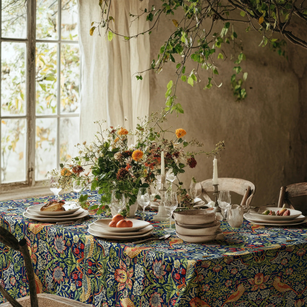 William Morris Strawberry Thief tablecloth in Country Blue on a dining table