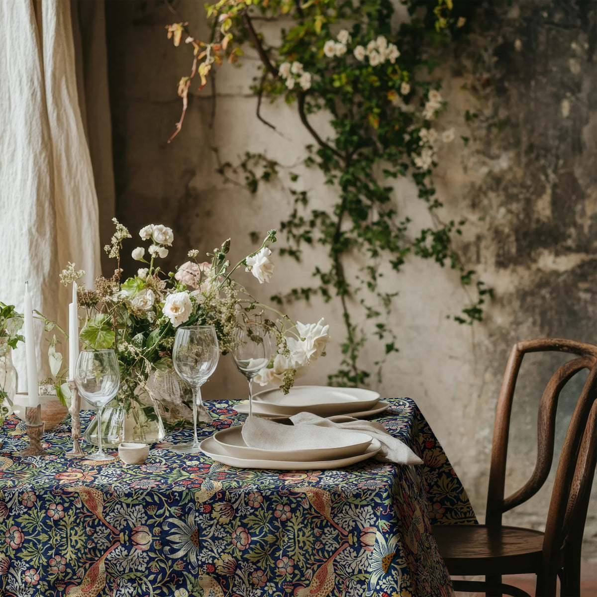 William Morris Strawberry Thief tablecloth in Country Blue with a place setting