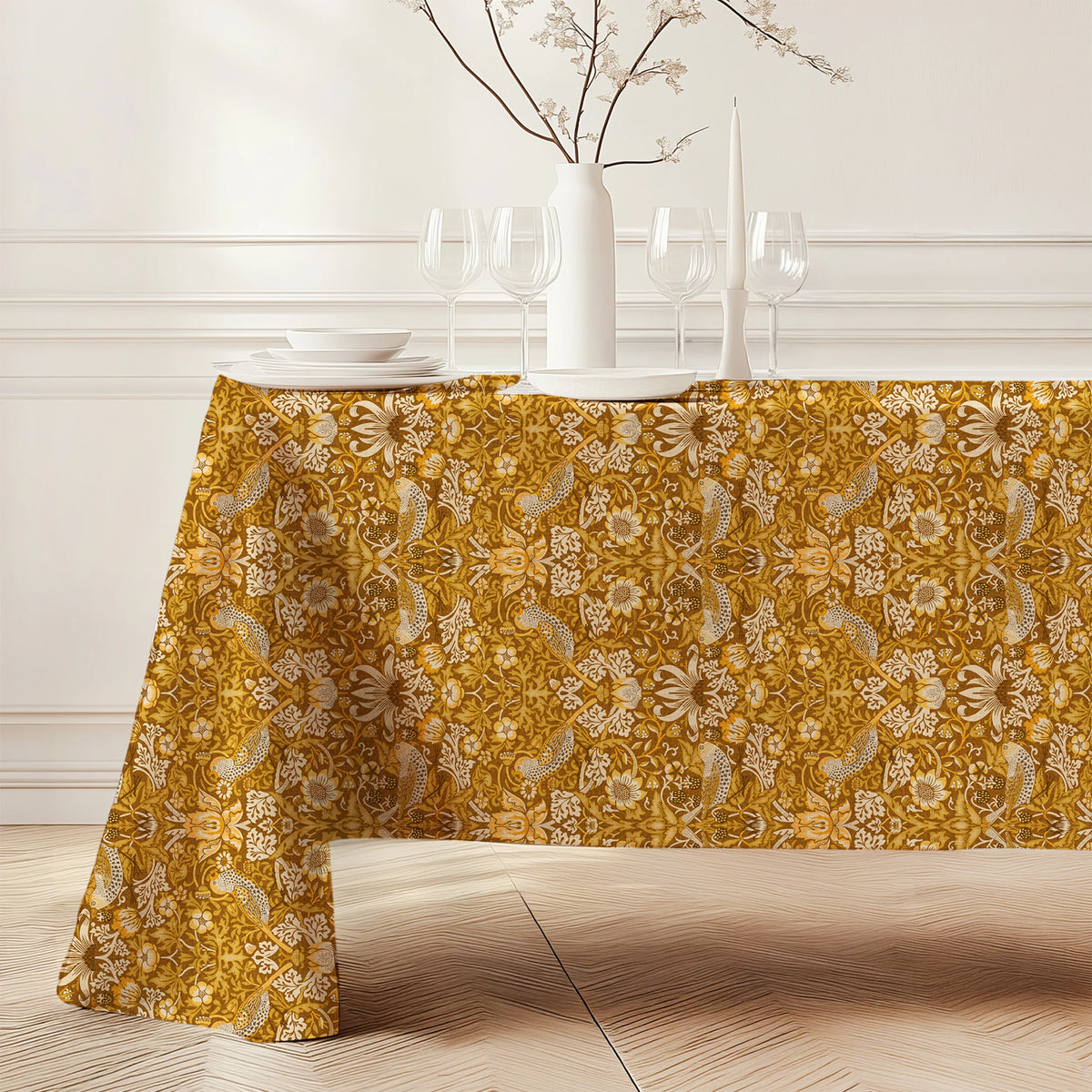 William Morris Strawberry Thief tablecloth in Golden Garden (3146) draped over a dining table, showing the full drop and corner