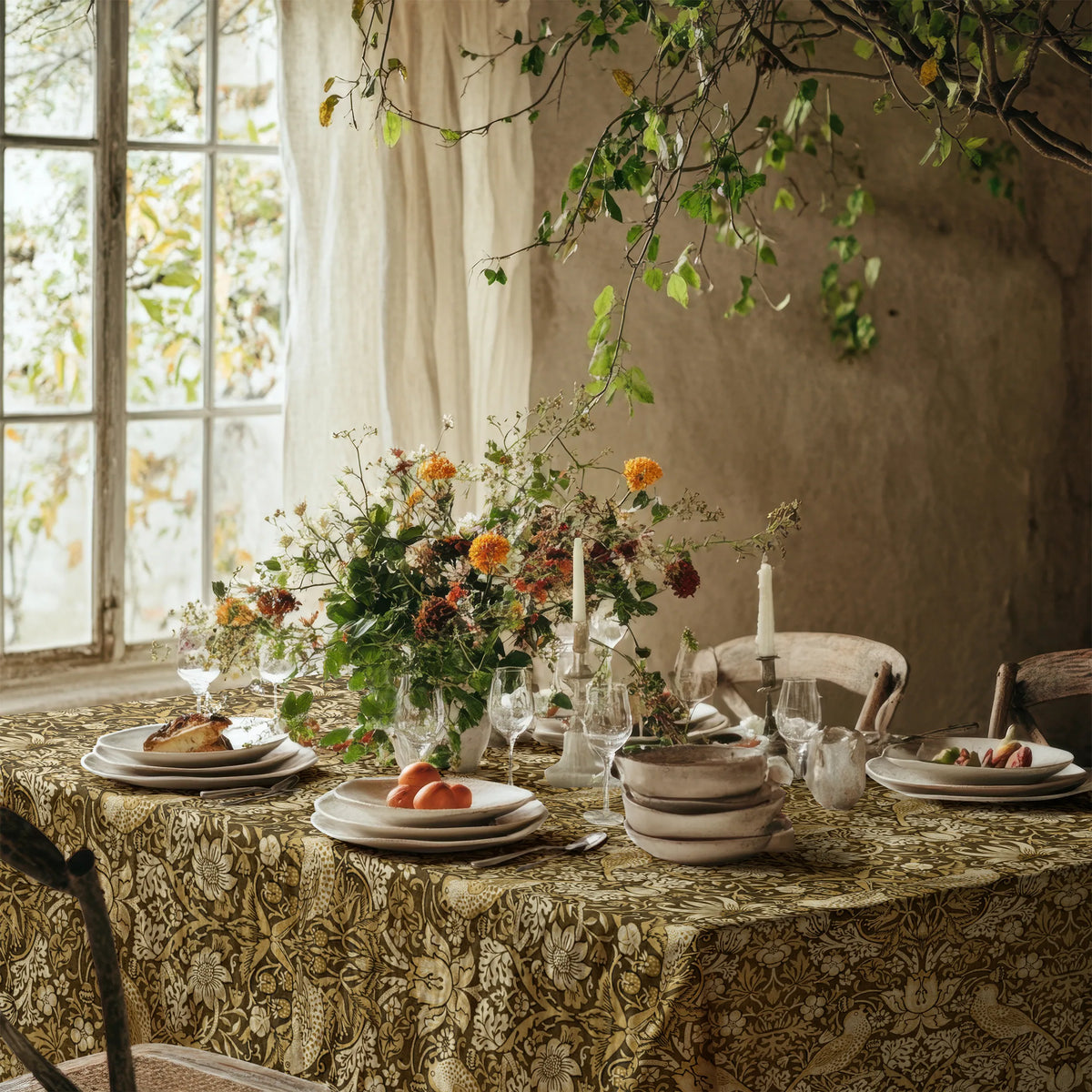 William Morris Strawberry Thief tablecloth in Golden Garden on a dining table