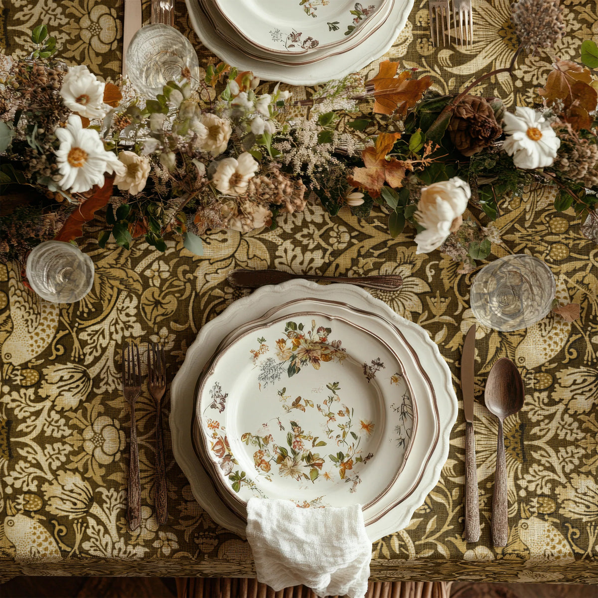 William Morris Strawberry Thief tablecloth in Golden Garden draped over a table edge
