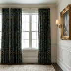 William Morris Blackthorn fabric in Classic Black made up as curtains at a tall sash window.