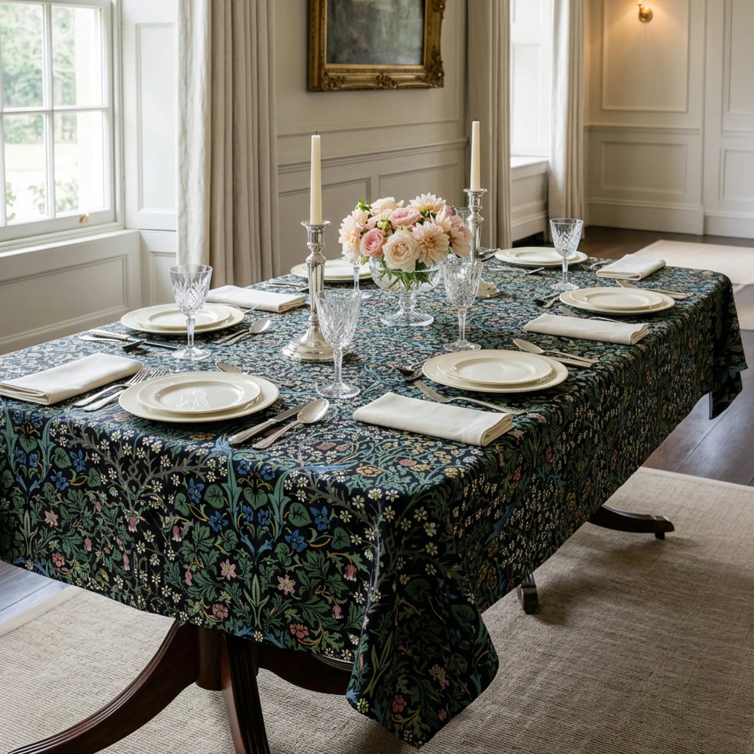 William Morris Blackthorn fabric in Classic Black sewn into a tablecloth on a dining table in a panelled English dining room.