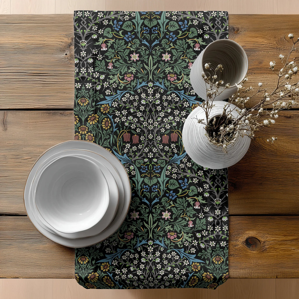 Easter table setting with a floral-patterned William Morris table runner in black on a wooden table