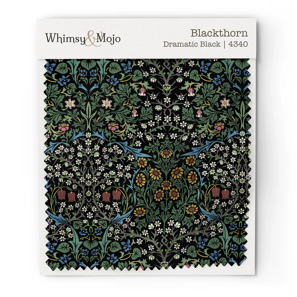 Fabric swatch of William Morris Blackthorn in Classic Black, showing color and texture up close.
