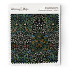 Fabric swatch of William Morris Blackthorn in Classic Black, showing color and texture up close.