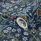 Wallpaper sample of William Morris Blackthorn in Dusky Blue Garden, showing the botanical pattern up close.