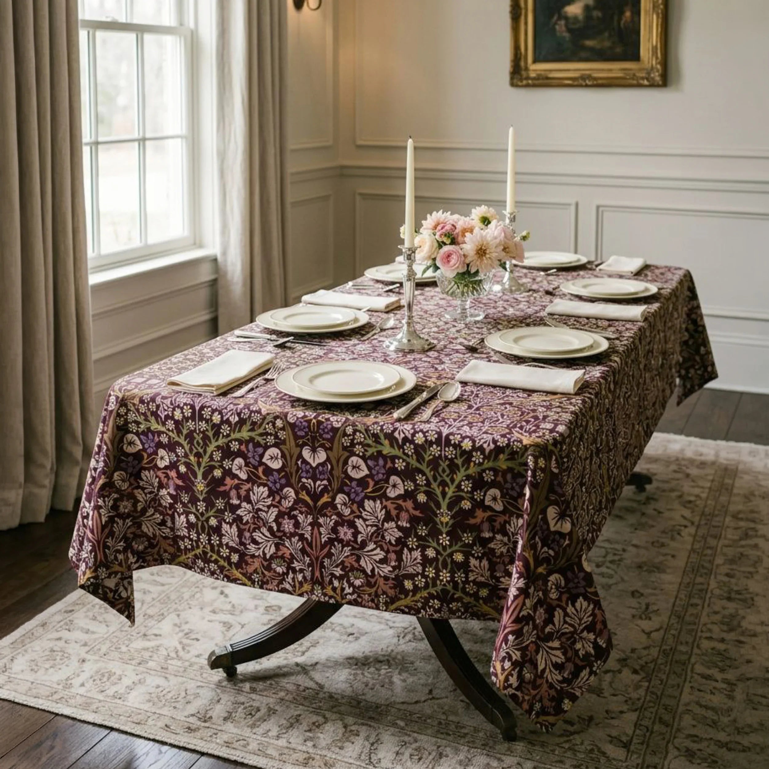 William Morris Blackthorn fabric in Maroon & Mauve sewn into a tablecloth on a dining table in a panelled English dining room.