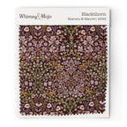 Fabric swatch of William Morris Blackthorn pattern in Maroon & Mauve colorway, showing color and texture up close.
