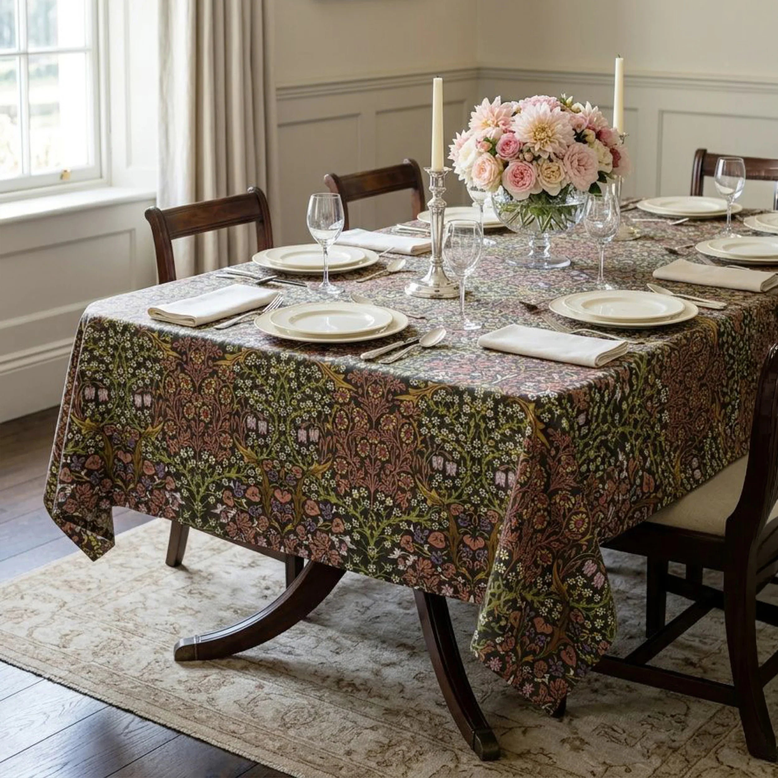 William Morris Blackthorn fabric in Secret Garden sewn into a tablecloth on a dining table in a panelled English dining room.