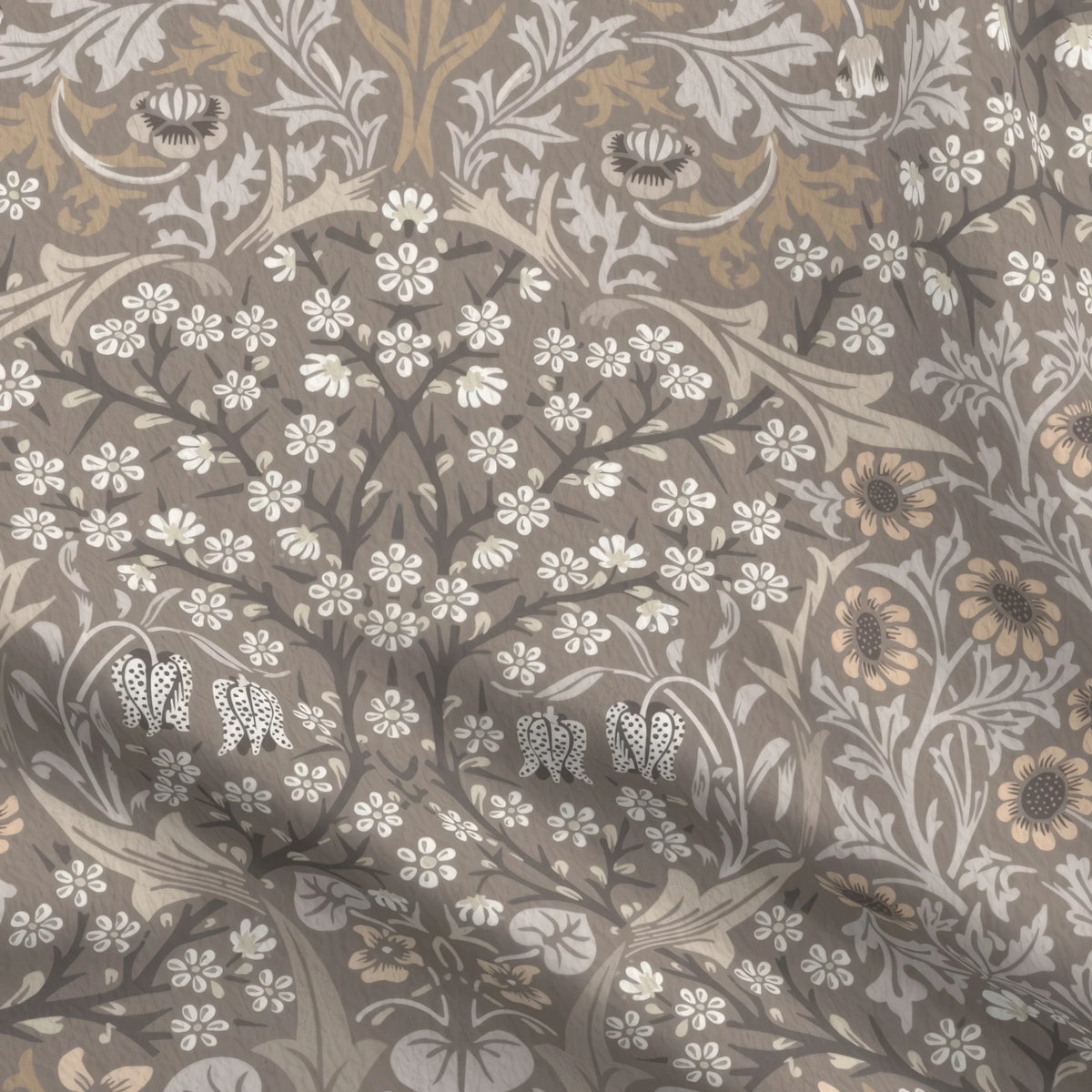 William Morris Blackthorn upholstery fabric in Heritage Taupe, close view of the printed cloth