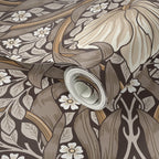 Decorative William Morris Pimpernel wallpaper in brown and beige tones.