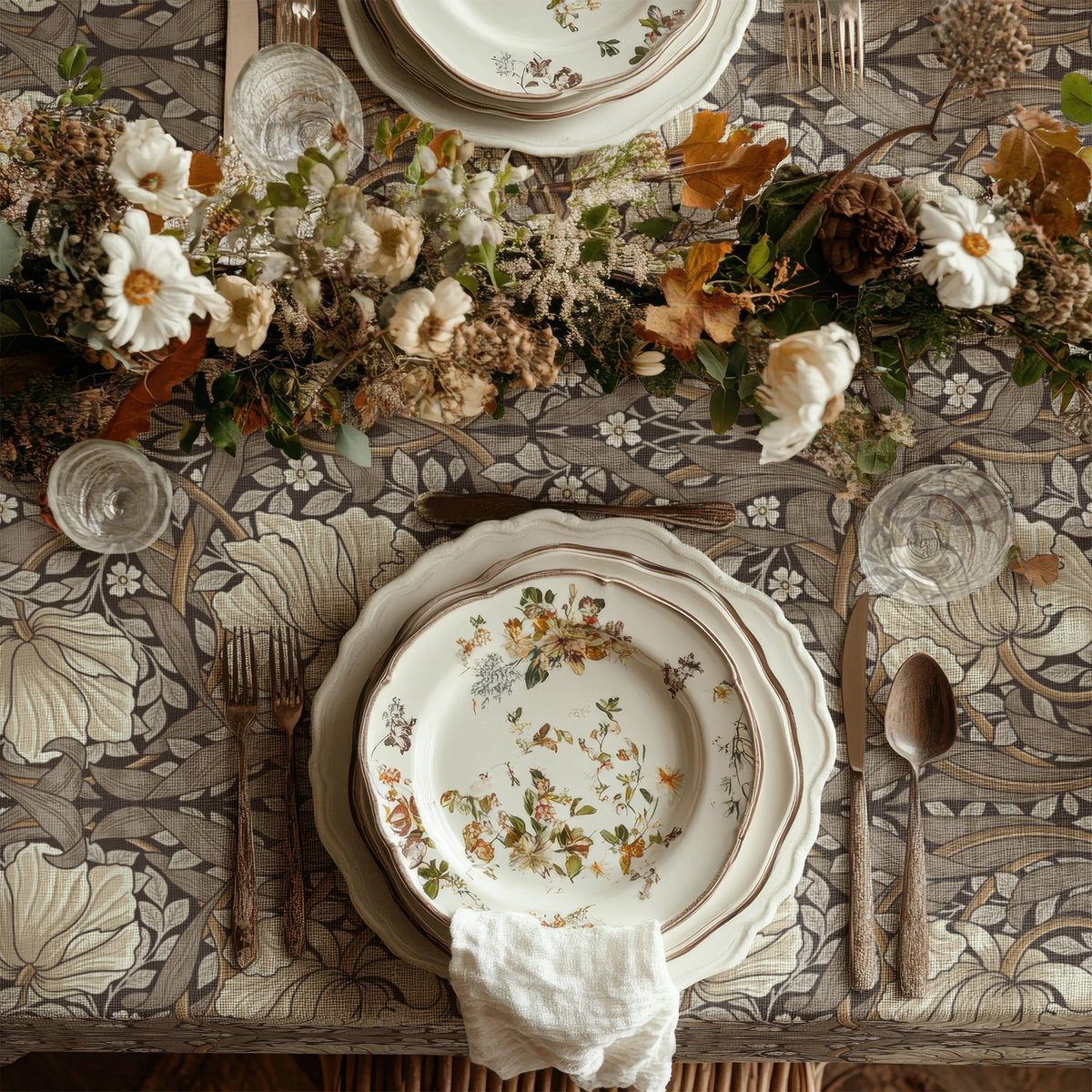 William Morris Pimpernel tablecloth in Rich Cocoa draped over a table edge