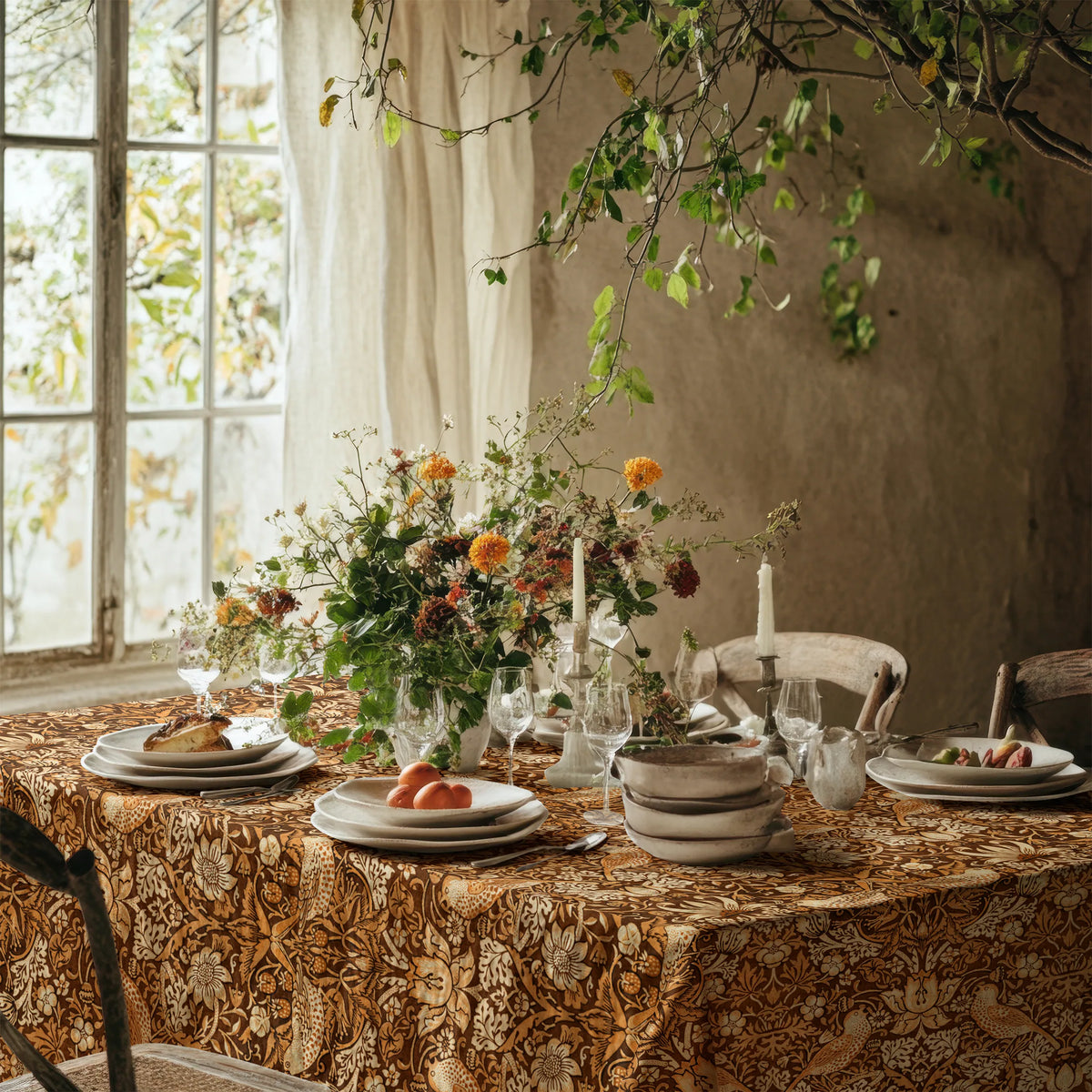 William Morris Strawberry Thief tablecloth in Pumpkin Spice on a dining table