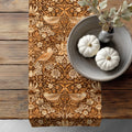 William Morris Strawberry Thief table runner featuring the iconic Arts and Crafts bird and botanical pattern, styled on a rustic wooden table for heritage revival and English country dining decor.