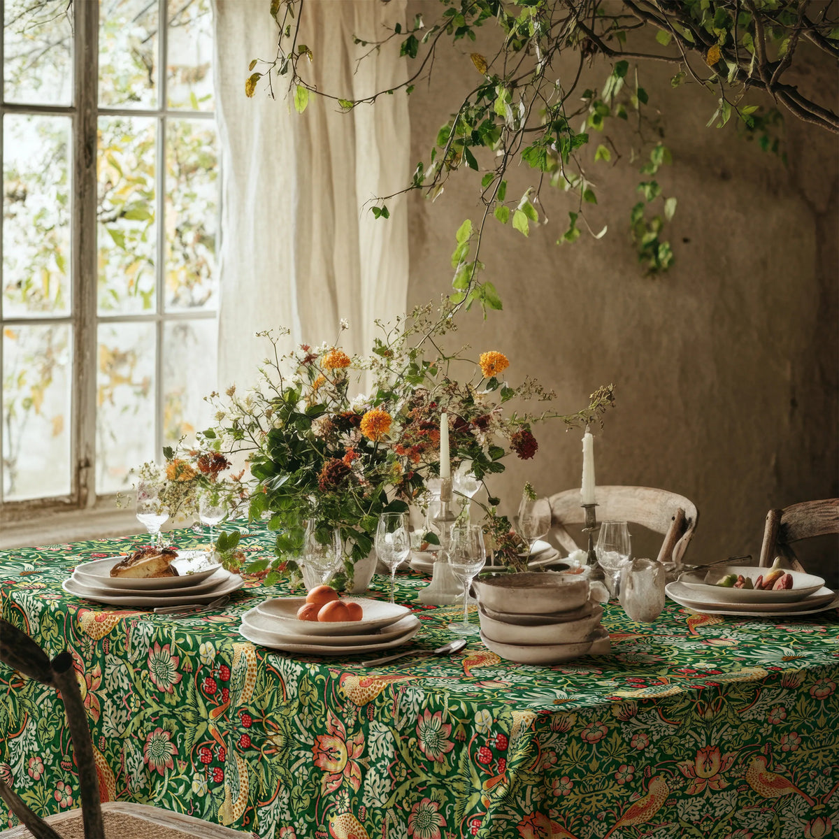 William Morris Strawberry Thief tablecloth in Forest Green on a dining table