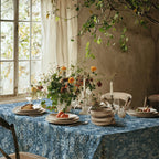 William Morris Strawberry Thief tablecloth in Chambray Blue on a dining table