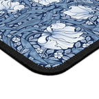 Corner close-up of the William Morris Pimpernel desk mat in Elegant Blue, showing the printed surface and stitched edge.