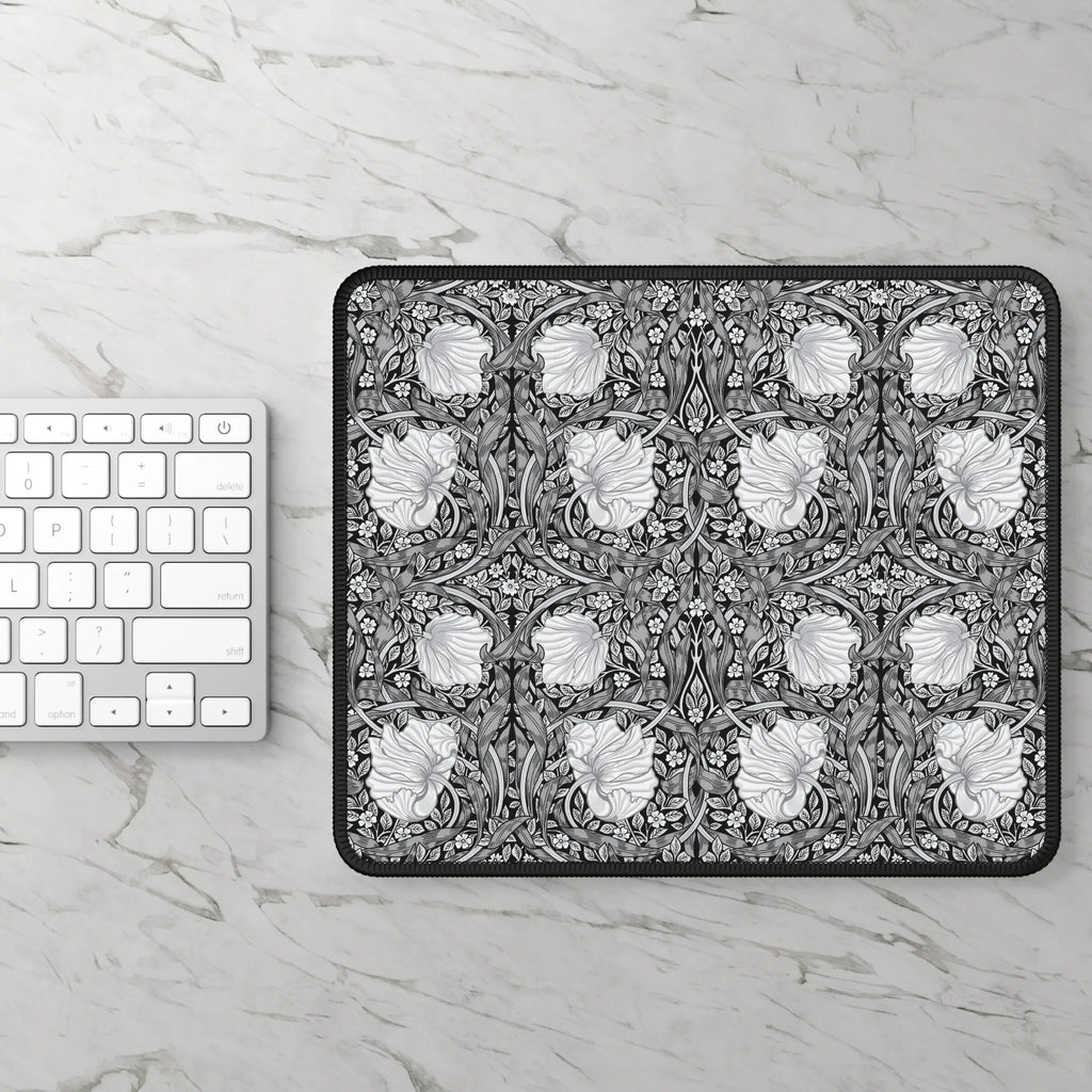 Floral patterned William Morris mouse pad on a marble surface with a keyboard.