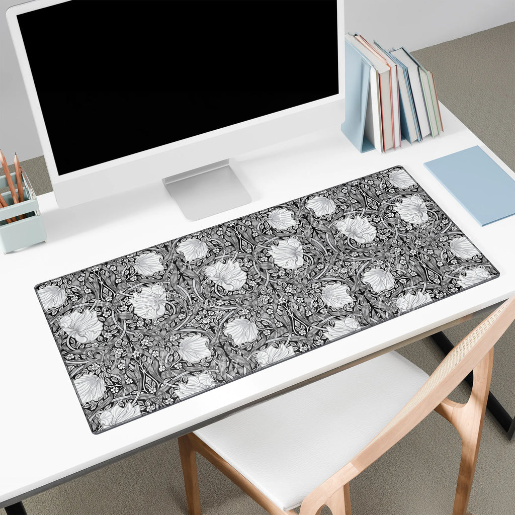 Large William Morris desk mat on a white desk with a computer setup