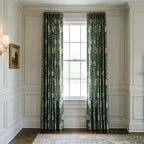William Morris Pimpernel curtains in Heritage Green at a tall window in a panelled room with a brass sconce