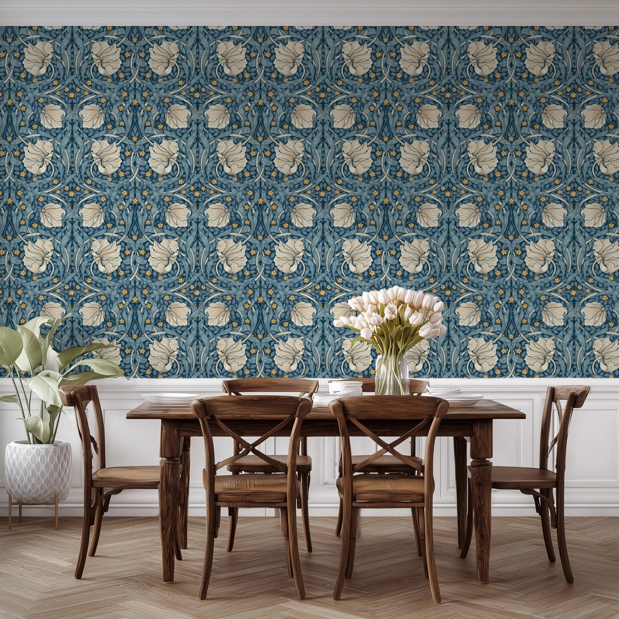 Dining room with William Morris wallpaper, wooden table and chairs. Pimpernel floral wallpapered wall.
