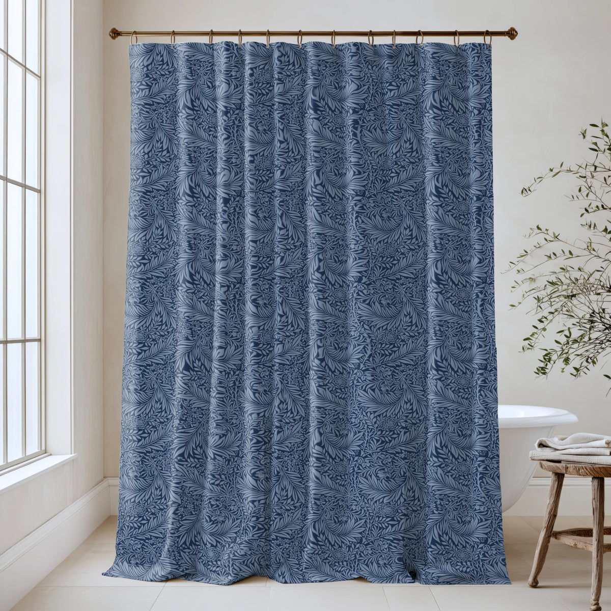 William Morris Larkspur extra long shower curtain in Nightfall Blue 4510: deep navy larkspur on a dusky midnight-blue ground. Floor-length tone-on-tone cotton sateen hung from a high-mounted rod in a bright bathroom, handmade to order in 84, 96 and 108 inch lengths.