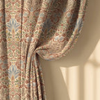 William Morris Snakeshead curtain fabric detail, soft folds showing botanical floral pattern. Harvest Grove colorway