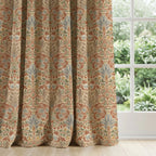 William Morris curtains draped elegantly across window, classic Snakeshead botanical pattern in Harvest Grove colorway