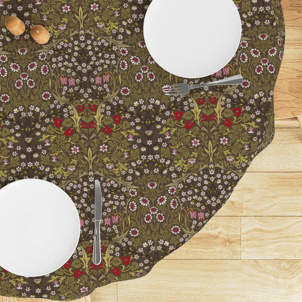 Round William Morris Blackthorn tablecloth in Chocolate & Olive with white plates and cutlery