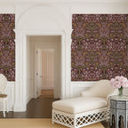 William Morris Blackthorn wallpaper in maroon styled in an elegant hallway with arched architecture, highlighting timeless Arts and Crafts botanical design.