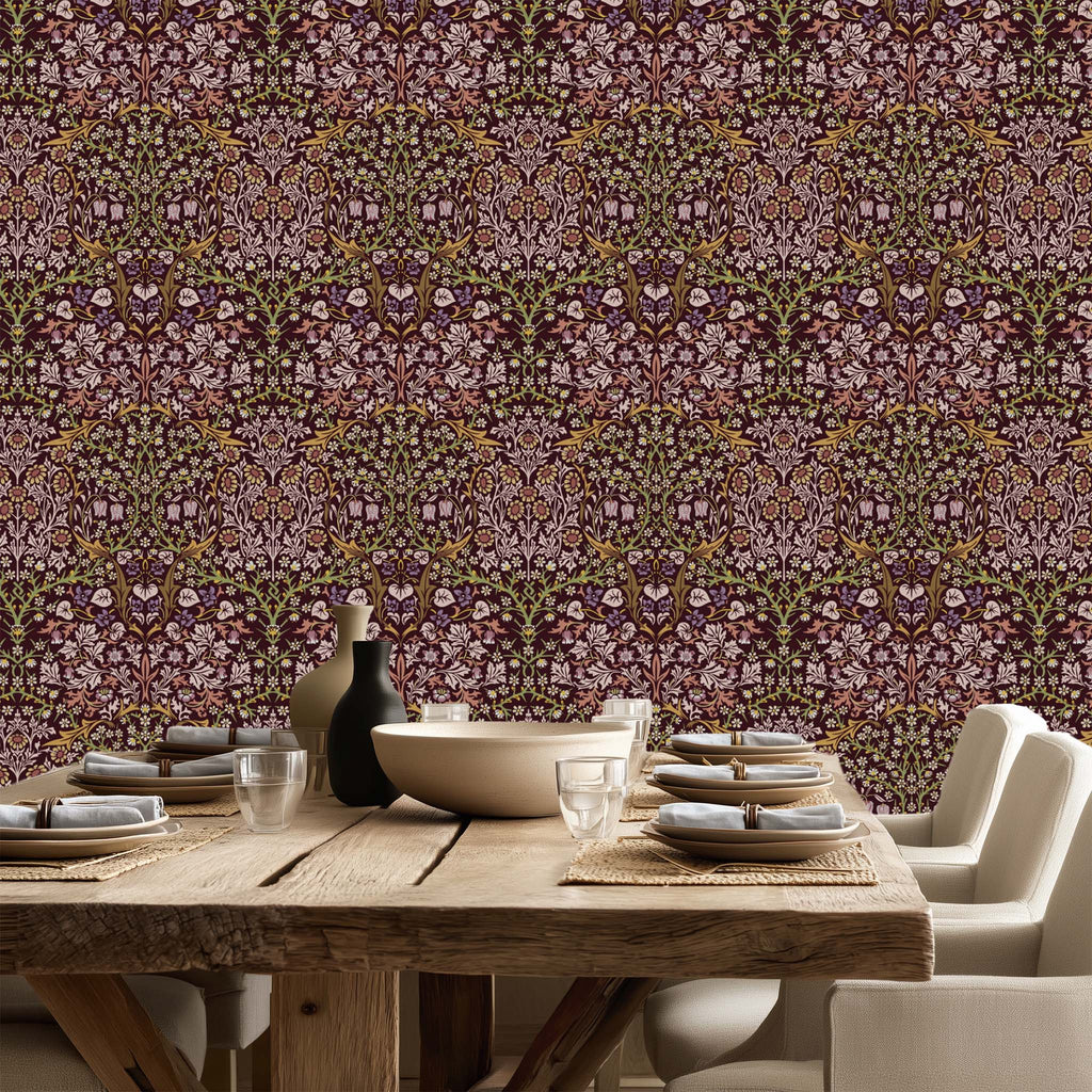William Morris Blackthorn wallpaper in maroon styled in a dining room with rustic wood table, showcasing a classic Arts and Crafts botanical pattern for cottagecore decor.