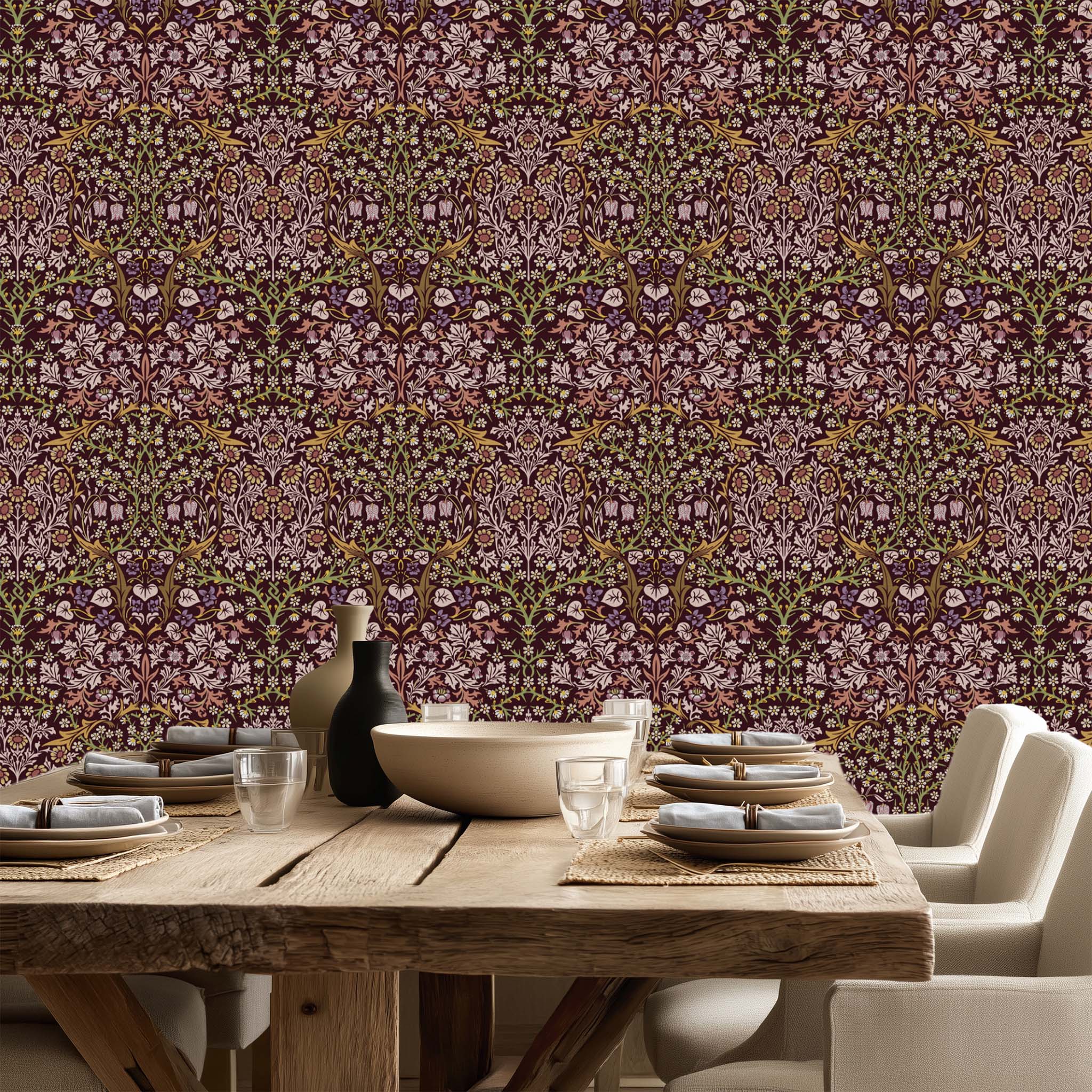William Morris Blackthorn wallpaper in maroon styled in a dining room with rustic wood table, showcasing a classic Arts and Crafts botanical pattern for cottagecore decor.
