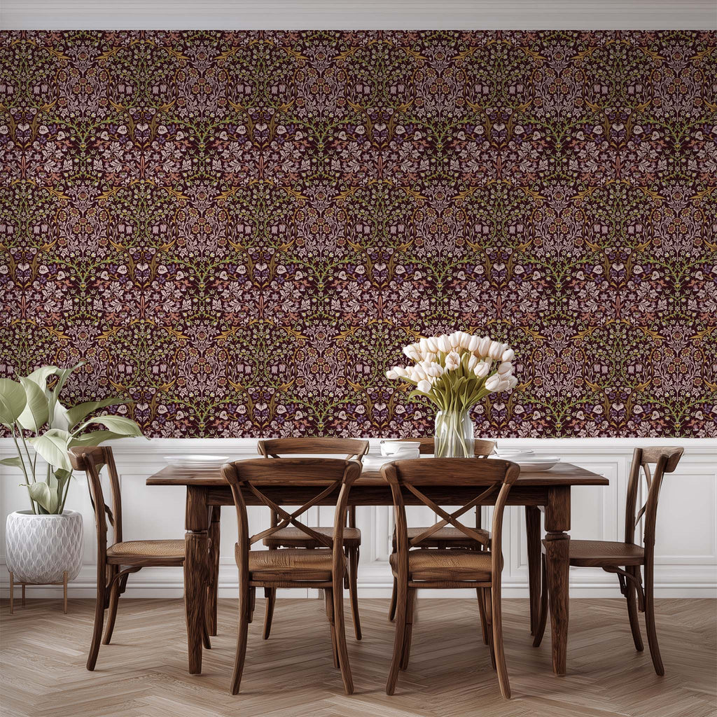 William Morris Blackthorn wallpaper in maroon styled in a dining space with neutral furnishings, emphasizing heritage revival and cottagecore interior styling.